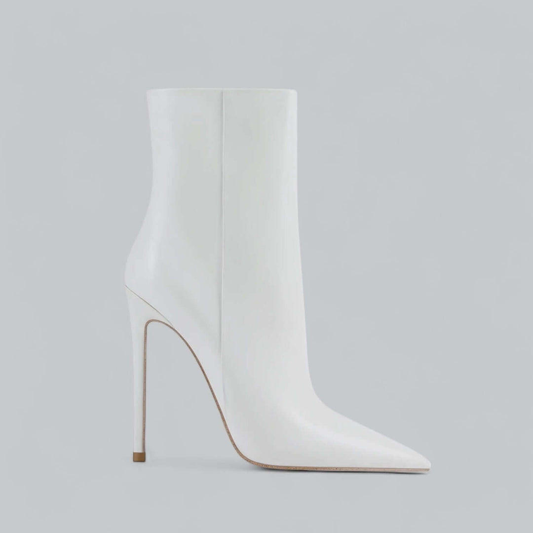 Elegant women's stiletto ankle boots with a distinct pointed toe, perfect for modern winter style.
