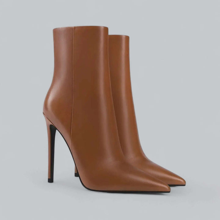 Dressy women's stiletto ankle boots with a sharp pointed toe, ideal for sophisticated winter outfits.