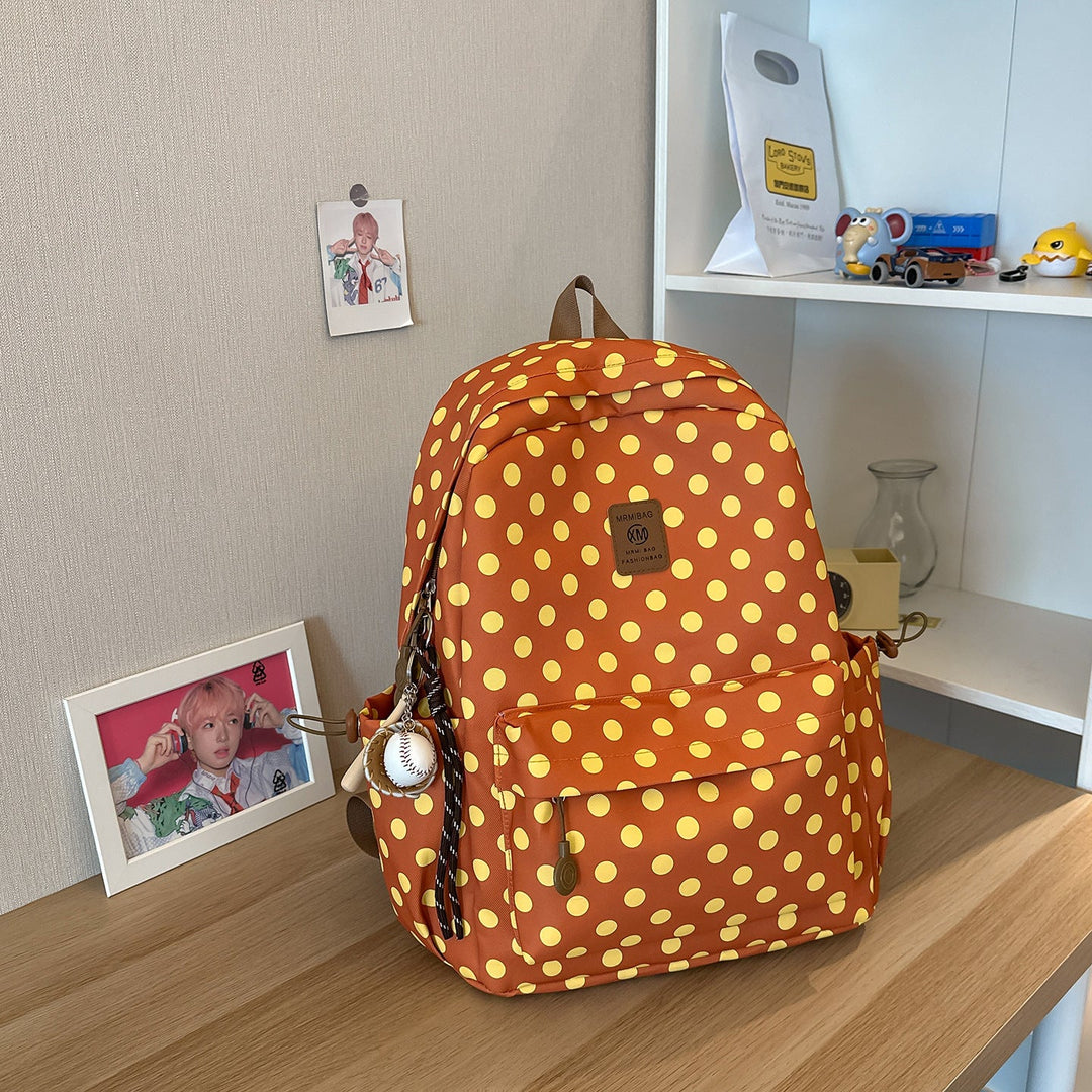 Women's black polka dot casual backpack, perfect for school or daily use. Spacious student daypack.