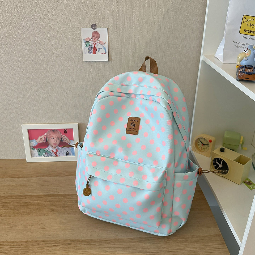 Versatile polka dot backpack for women; ideal as a school bag, student daypack, or light travel carry-on.