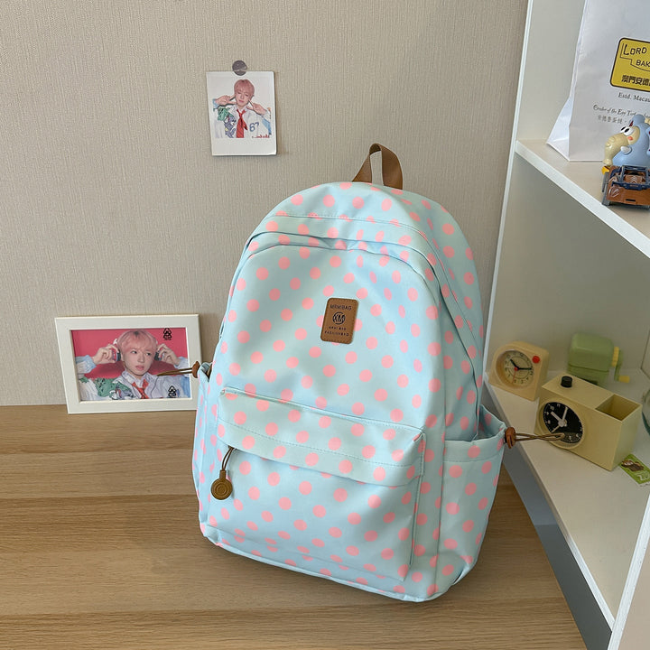 Versatile polka dot backpack for women; ideal as a school bag, student daypack, or light travel carry-on.