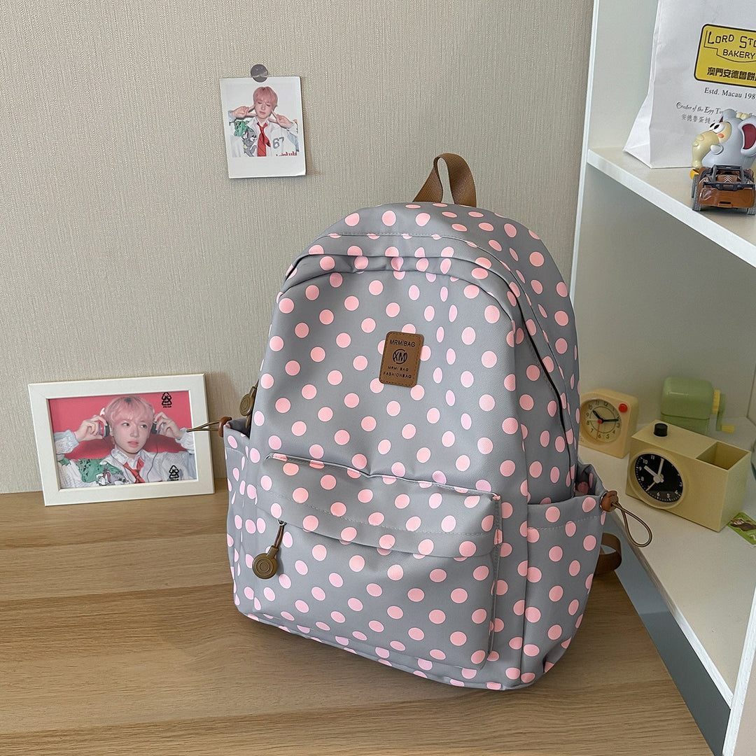 Trendy women's polka dot backpack, a chic casual school bag or travel daypack for students and daily use.