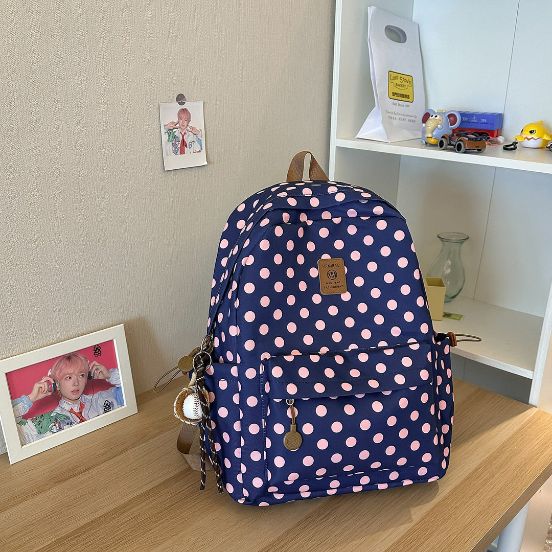 Comfortable women's polka dot school backpack, spacious and sturdy student bag for books and essentials.