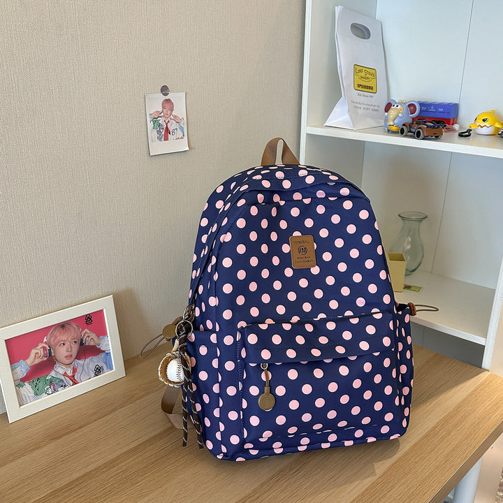 Comfortable women's polka dot school backpack, spacious and sturdy student bag for books and essentials.