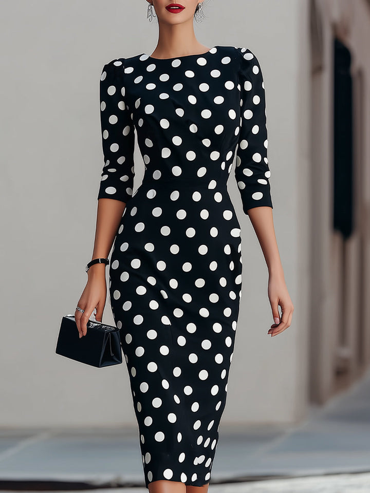 Elegant women's halter neck polka dot midi dress. Figure-hugging bodycon silhouette, vintage-inspired style.