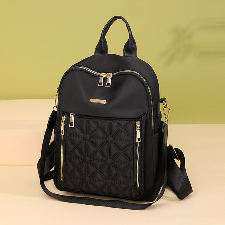 Women's black quilted fashion backpack with multi-compartment design, durable for daily use & travel.
