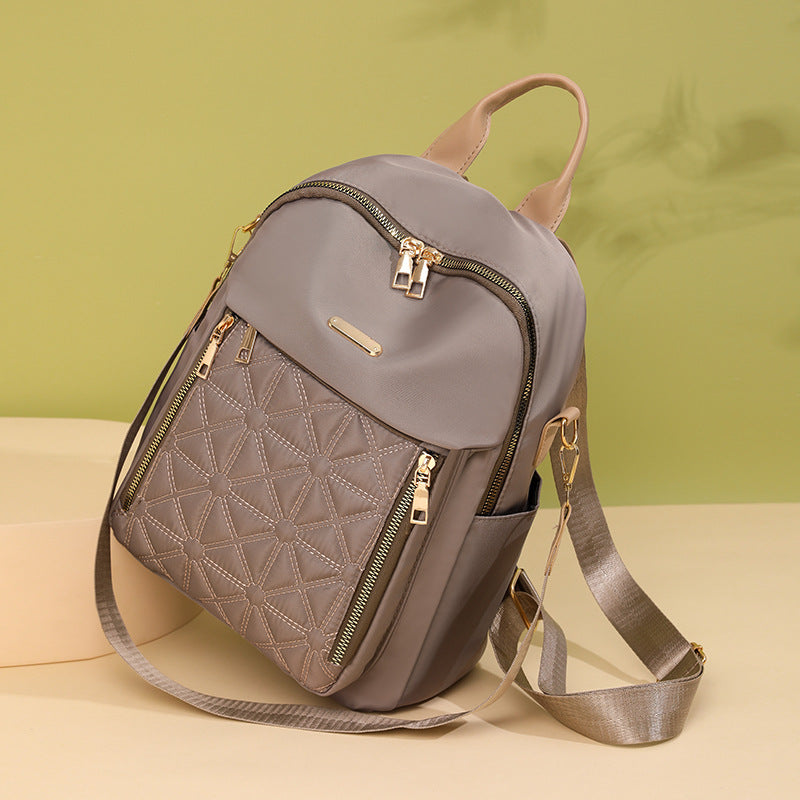 Elegant women's quilted multi-compartment travel backpack, perfect for organizing essentials for work or trips.