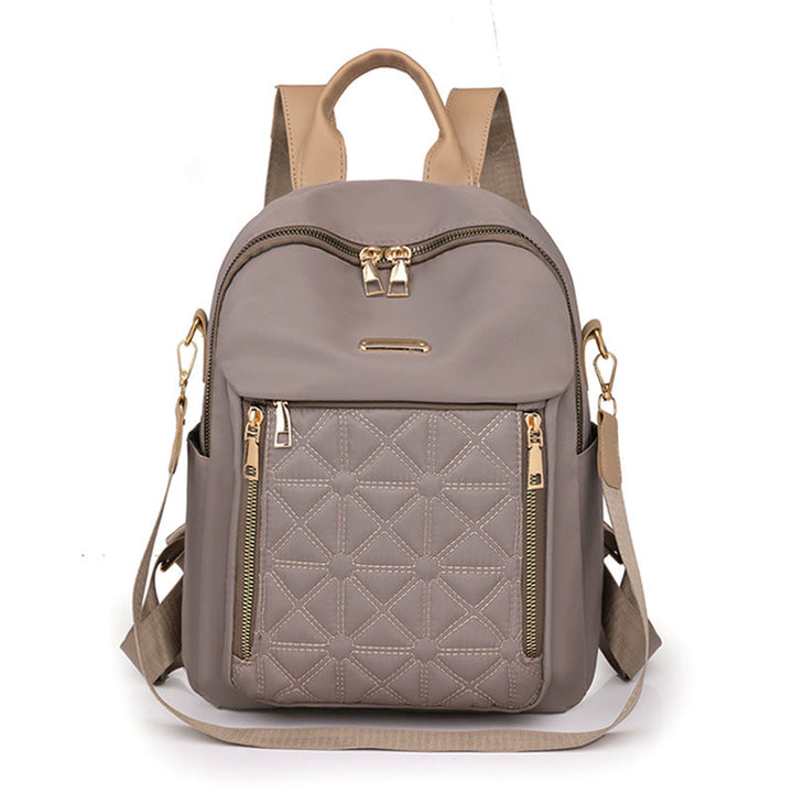 Practical multi-compartment women's quilted backpack, perfect for organizing school supplies, work items, or travel gear.