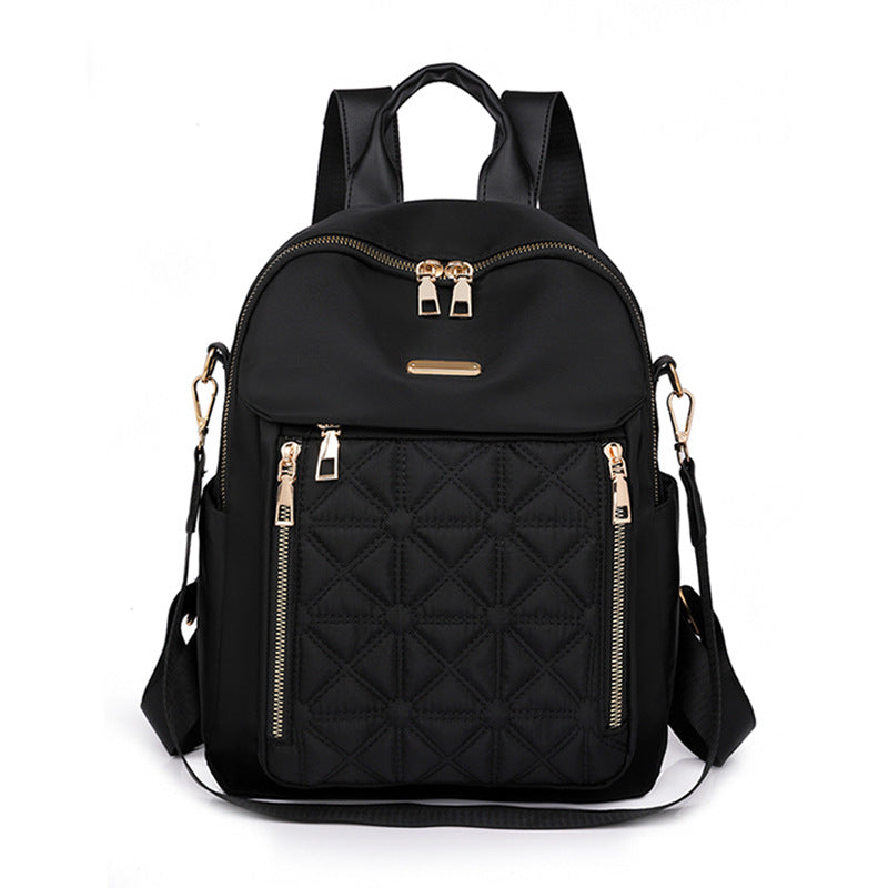 Black women's quilted fashion backpack, a durable multi-compartment bag for school, work, and elegant daily travel.