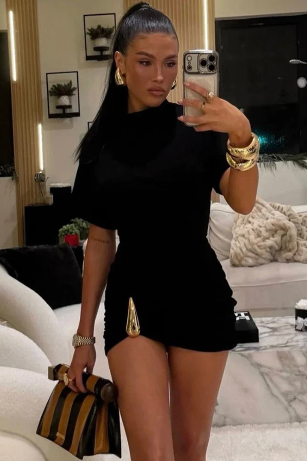 Elegant black ruched bodycon mini dress with short sleeve & high neck. Ideal women's party or cocktail dress.