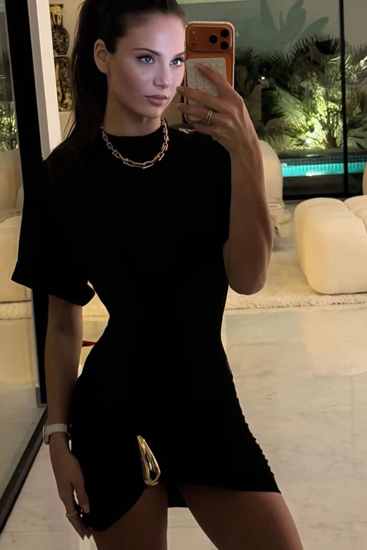 Women's black ruched bodycon mini dress. Stylish short sleeve & high neck, great for wedding guests.