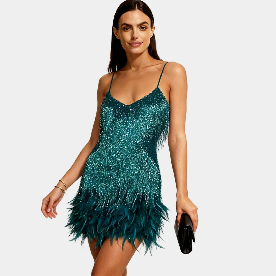 Dazzling sequin and feather mini dress for unforgettable evenings.