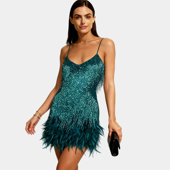 Dazzling sequin and feather mini dress for unforgettable evenings.