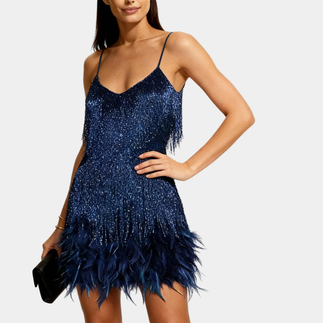 Exquisite evening party dress with all-over sequins and feather hem.