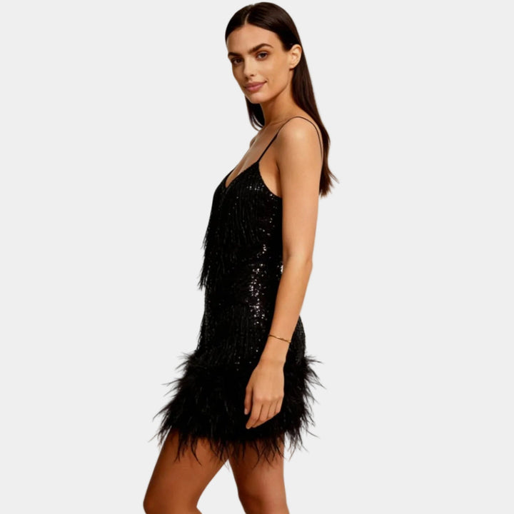 Glamorous short party dress with shimmering sequins and soft feathers.
