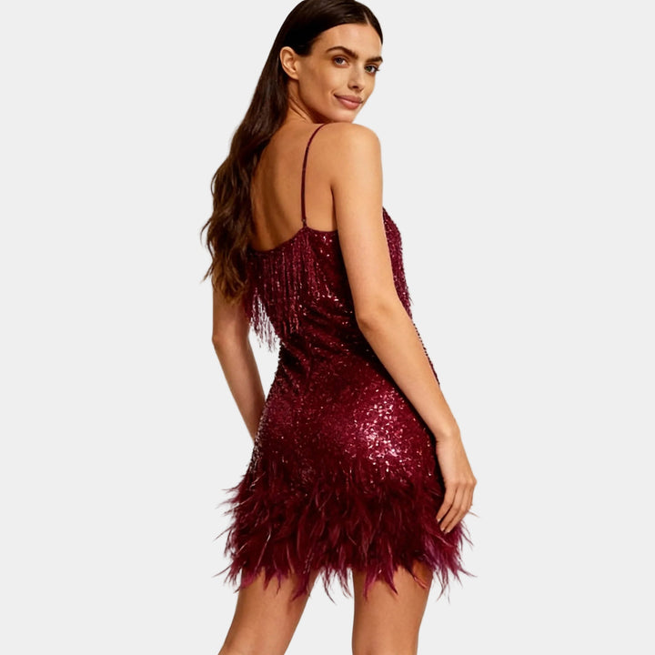 Fashionable women's dress: sequin and feather mini style for parties.