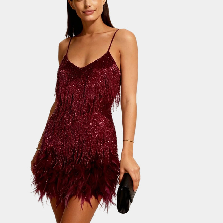 Sophisticated short dress featuring intricate sequin and feather details.