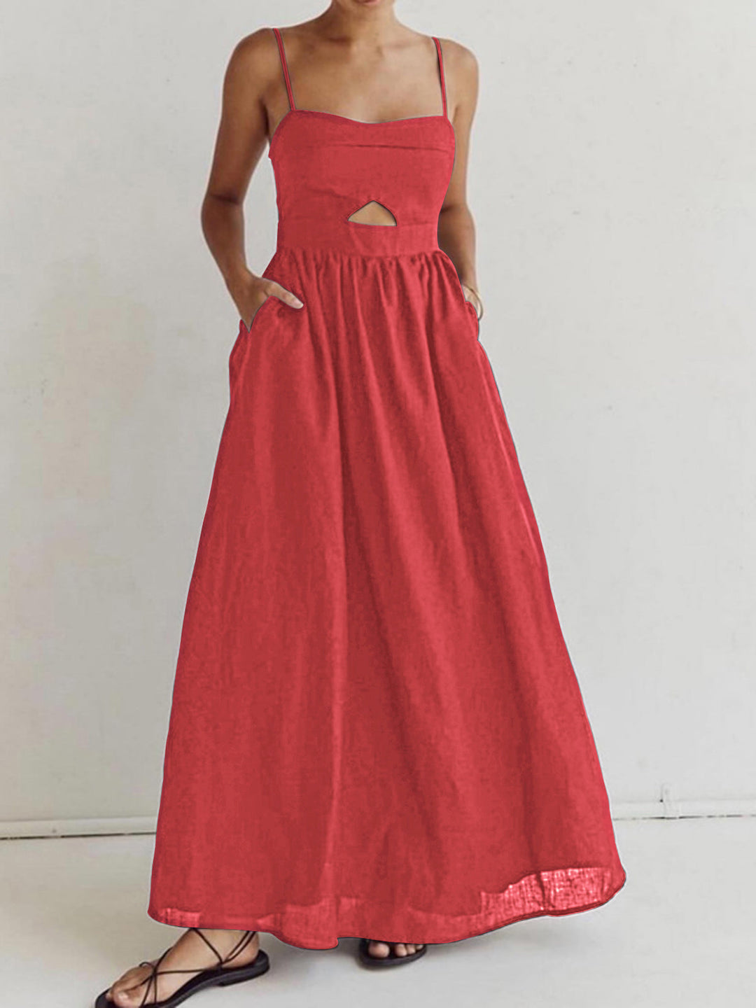 Red women's midi dress, sleeveless with a stylish cutout & functional pockets. Perfect casual summer wear.