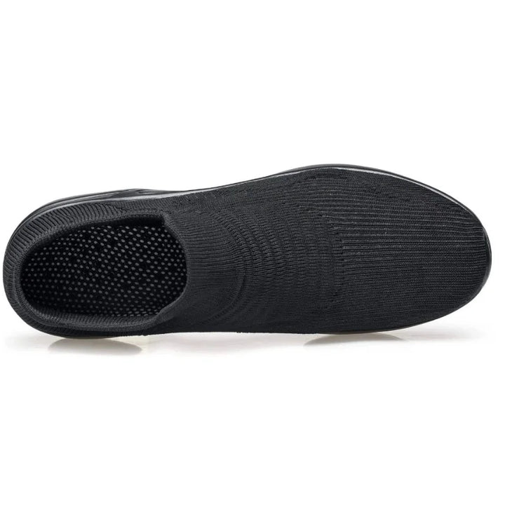 Women's black slip-on sneakers, air-cushion sole, arch support, perfect for active everyday wear.