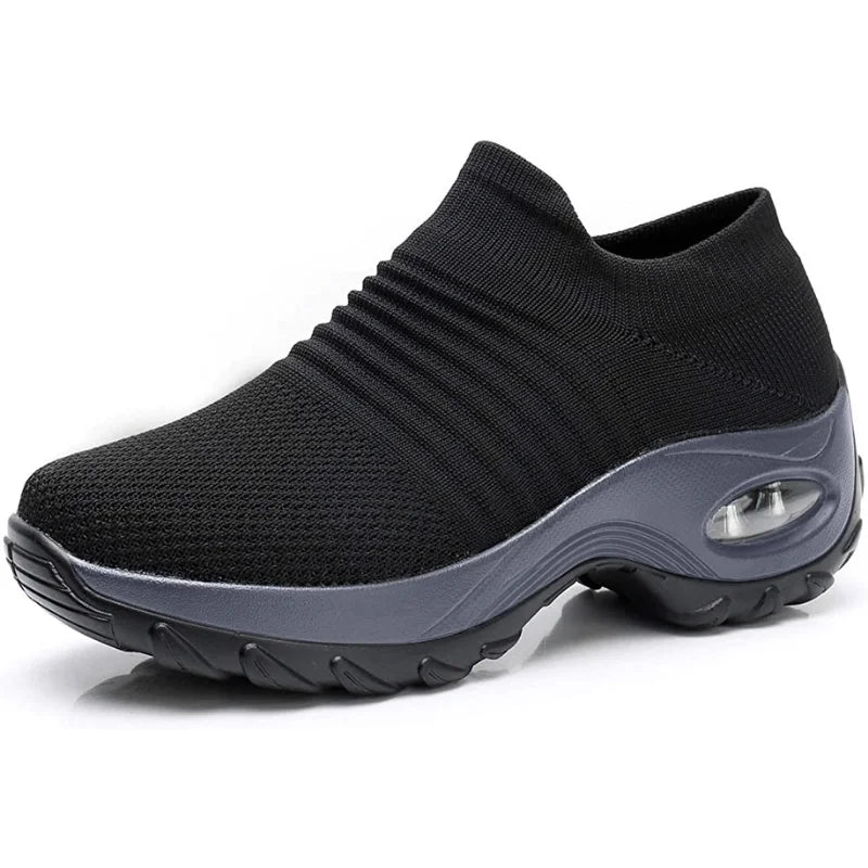 Supportive women's slip-on sneakers, black, with cushioned sole, ideal for walking & everyday wear.