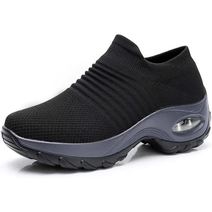 Supportive women's slip-on sneakers, black, with cushioned sole, ideal for walking & everyday wear.