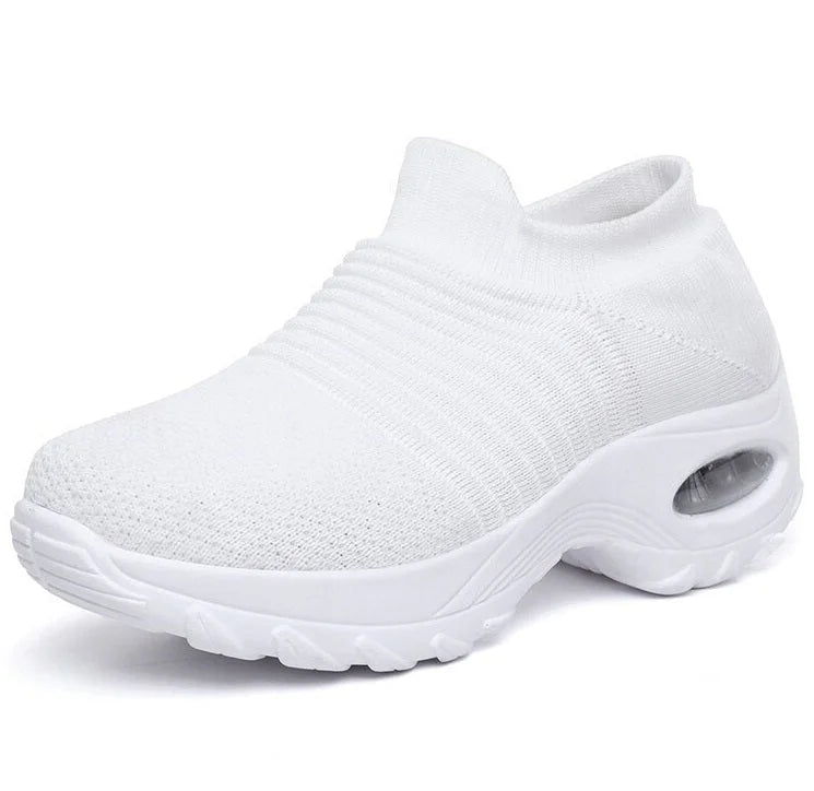 Supportive black slip-on sneakers for women, air-cushion sole, great for all-day comfort.