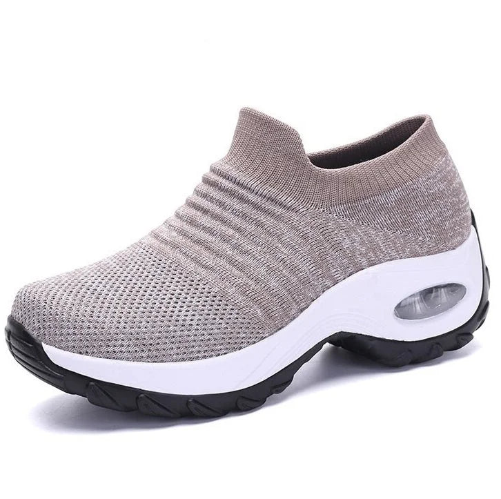 Women's walking slip-on sneakers, black, with air-cushion sole & arch support for comfort.