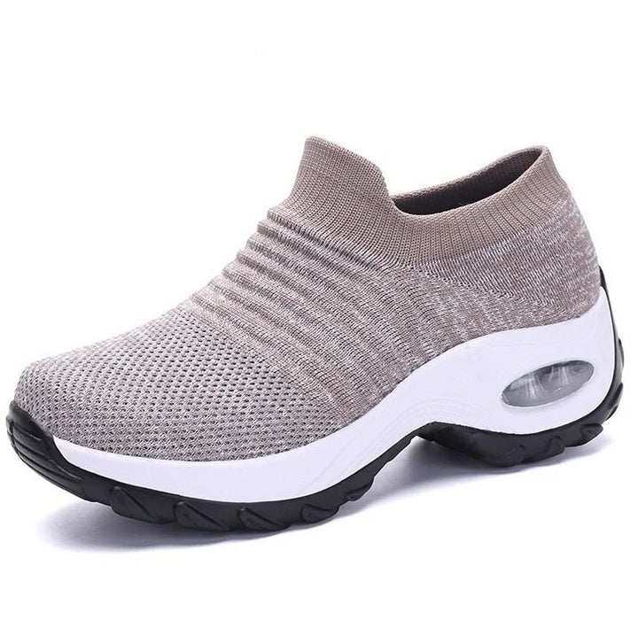 Women's walking slip-on sneakers, black, with air-cushion sole & arch support for comfort.