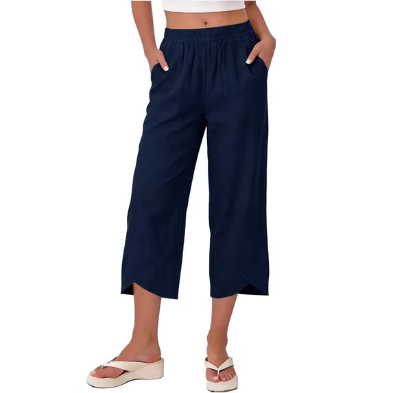 Close-up of soft, stretchy fabric on women's wide leg capri trousers, showing quality.