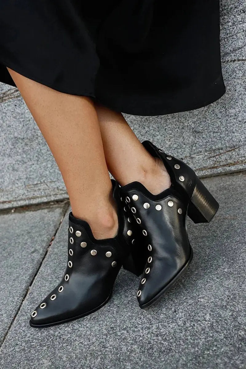 Women's black studded block-heel ankle boots with a pointed toe for edgy fashion. Perfect for a night out.