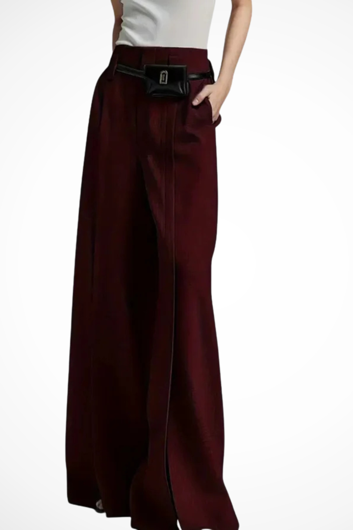 Chic women's wide leg trousers in black, featuring a stylish pouch belt, ideal for modern office and evening fashion.