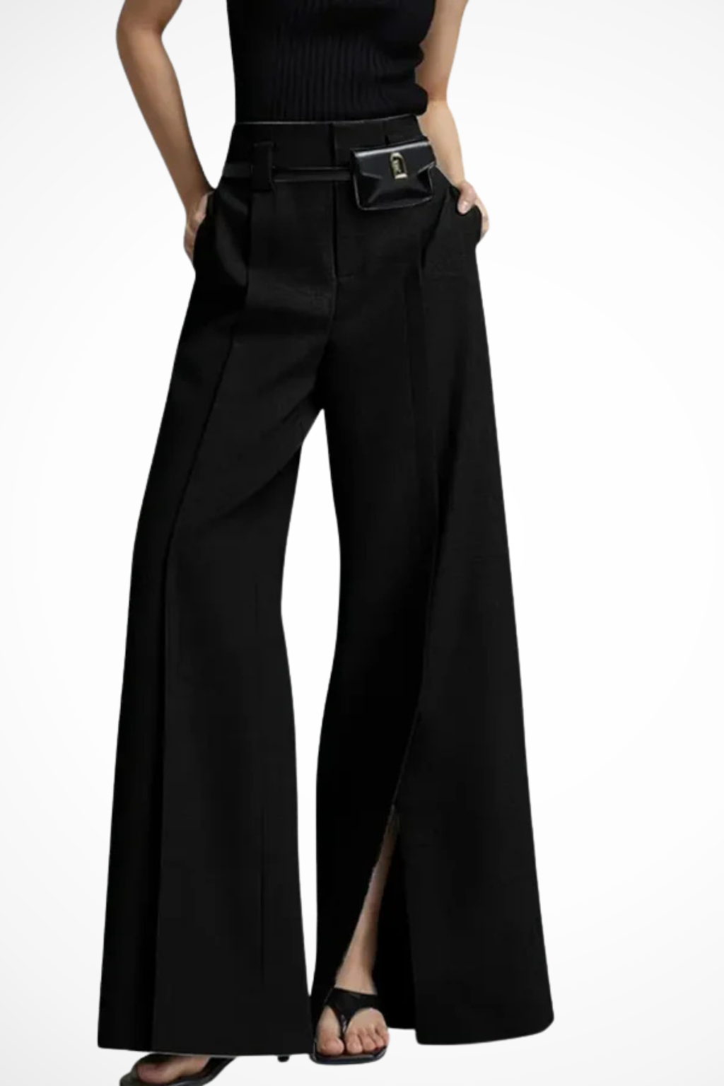Close-up of the fashionable pouch belt on women's tailored wide leg trousers, adding a modern accessory detail.