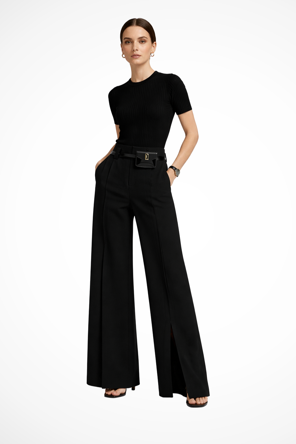 Side profile of women's black wide leg tailored trousers, showcasing flowy fabric and flattering high-waisted design.