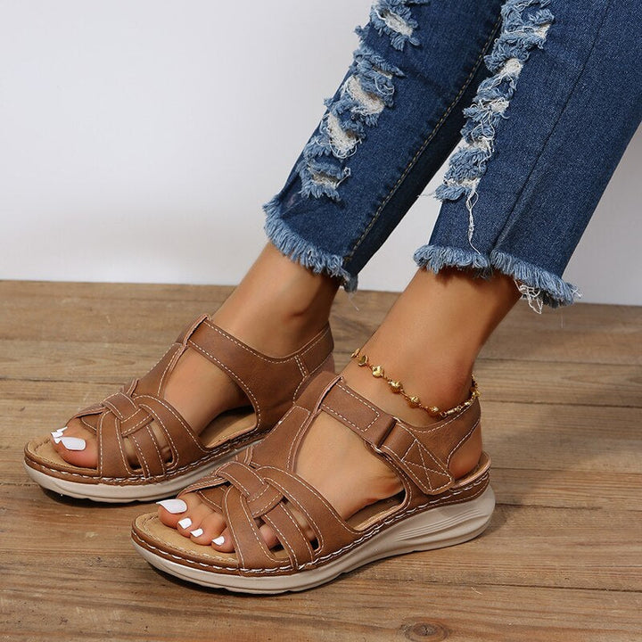 Women's supportive walking sandals with deep contoured footbed and arch support for active comfort.