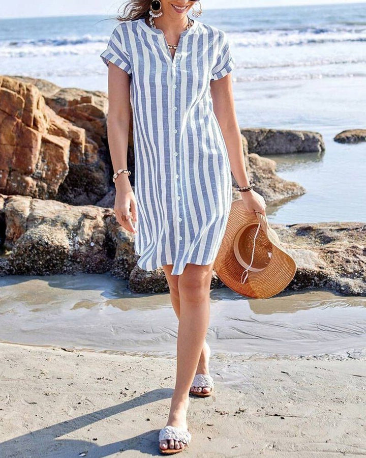 Women's casual striped button-up dress, ideal as a vacation outfit or beach cover-up, offering effortless summer style.