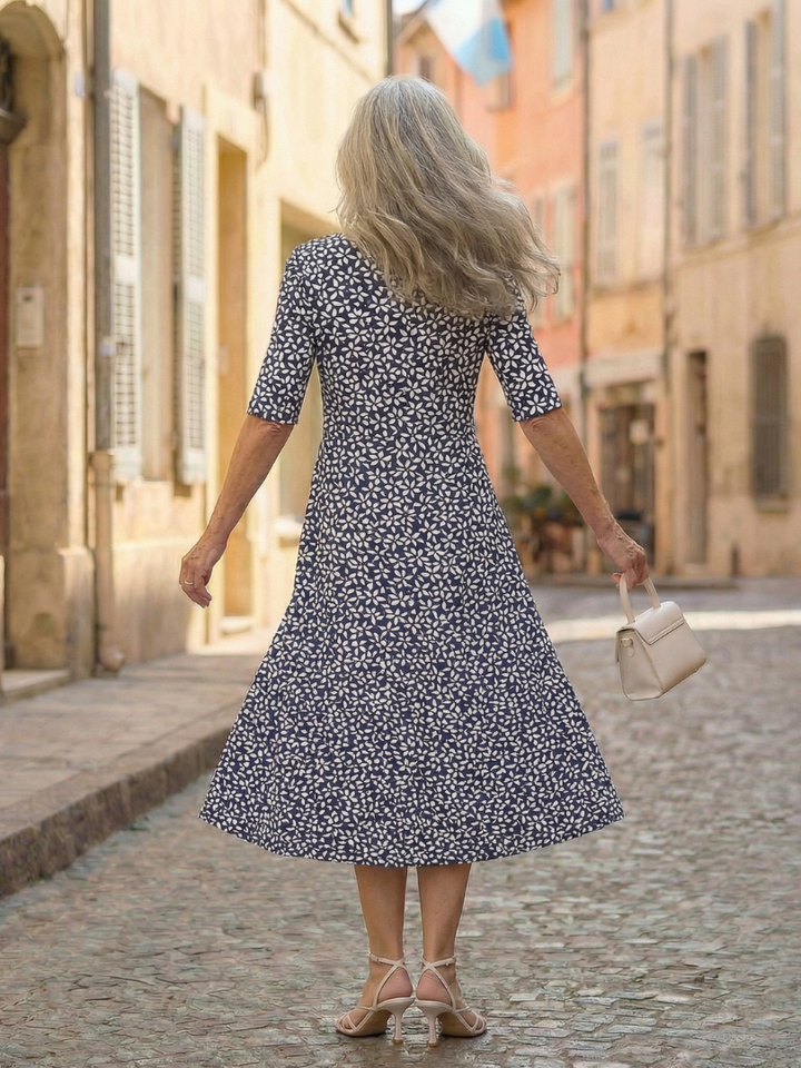 Comfortable women's blue coastal pattern midi dress with three-quarter sleeves and a relaxed fit.
