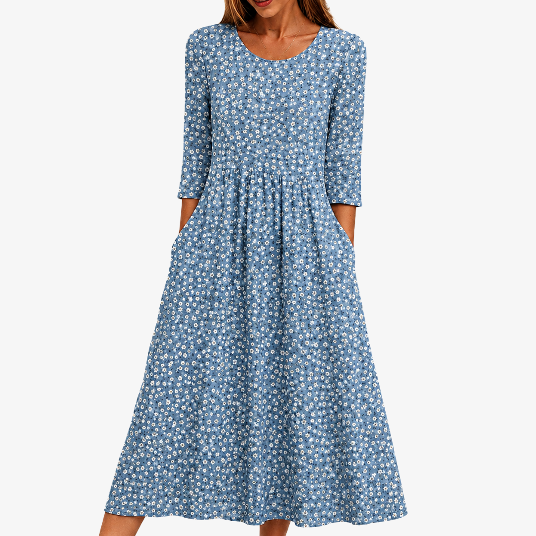 Women's blue daisy floral maxi dress with pockets. Ideal for summer casual wear, garden parties, or everyday comfort.