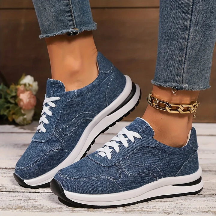 Women's blue denim orthopedic sneakers with arch support, designed for comfortable walking & casual style.