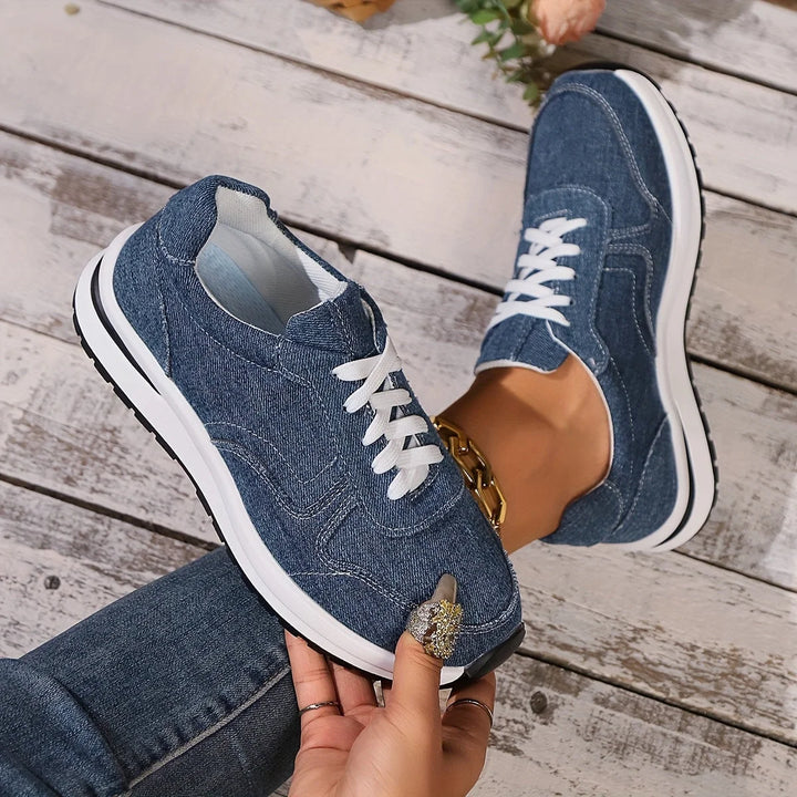 Orthopedic women's denim sneakers with built-in arch support, offering stylish comfort for casual walking.