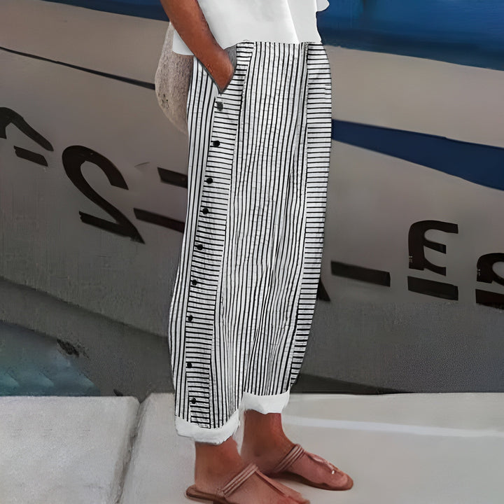 Versatile women's black lightweight travel pants with a relaxed fit and elastic waist for effortless summer style.