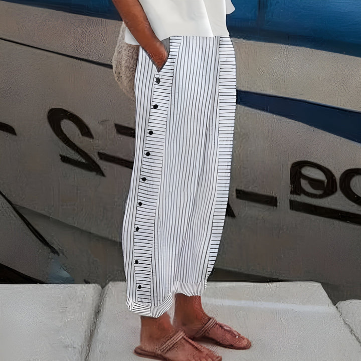 Comfortable grey women's summer trousers, lightweight and breathable, perfect for casual wear or relaxed travel.