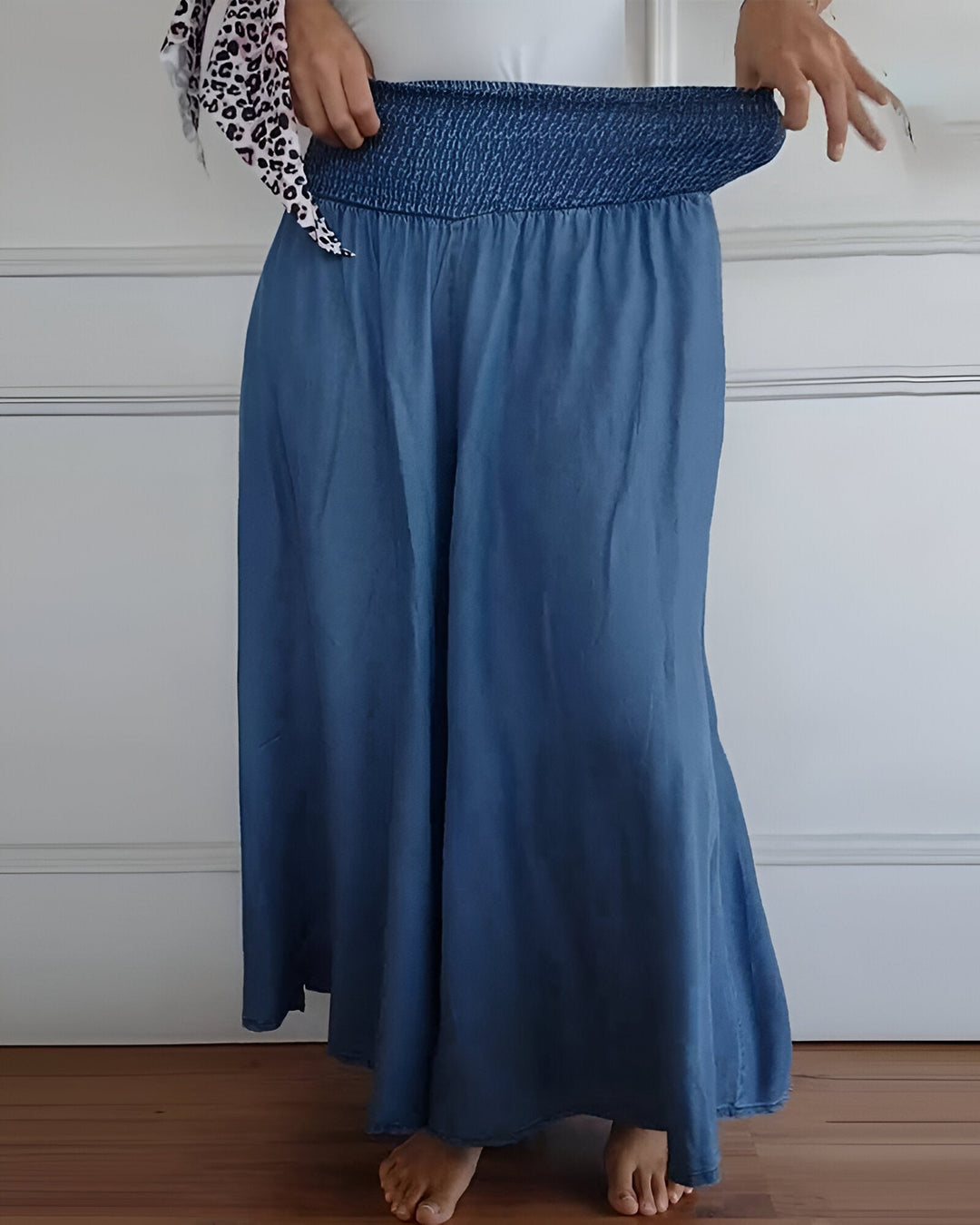 Versatile women's grey maxi skirt, featuring a wide smocked waist. Ideal for casual wear, comfortable & stylish.