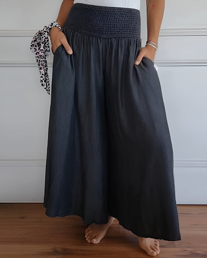 Stylish women's maxi skirt with wide smocked waistband for comfort & flattering fit. Versatile casual summer skirt.