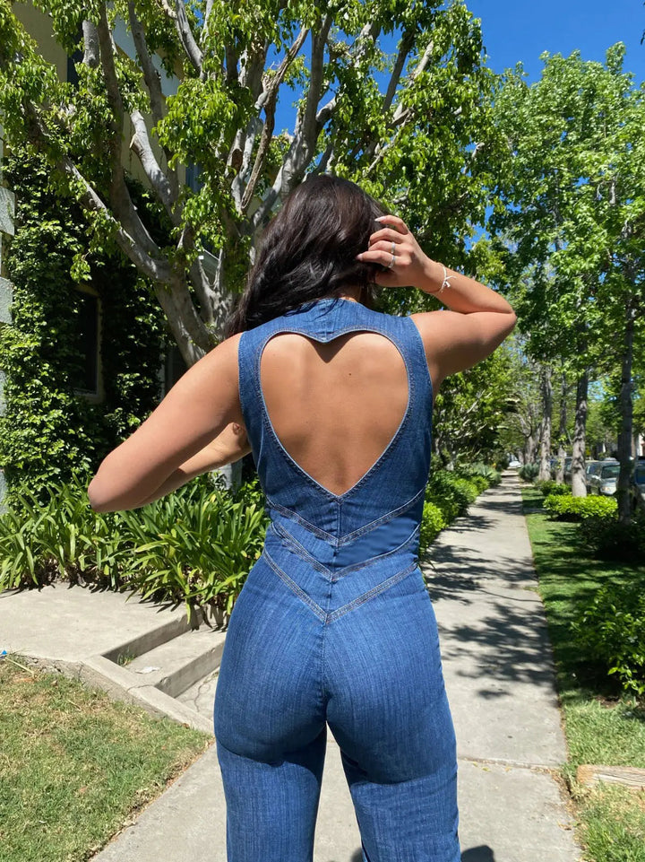Stunning women's blue plunge neck jumpsuit. Fitted and flared one-piece, ideal for elegant party & festival wear.