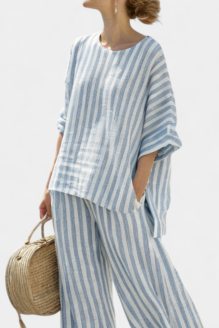 Sophisticated women's two-piece blue striped top & comfy relaxed fit trousers for elegant summer style.