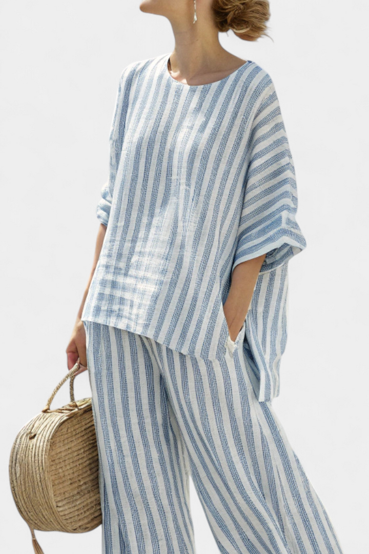 Sophisticated women's two-piece blue striped top & comfy relaxed fit trousers for elegant summer style.