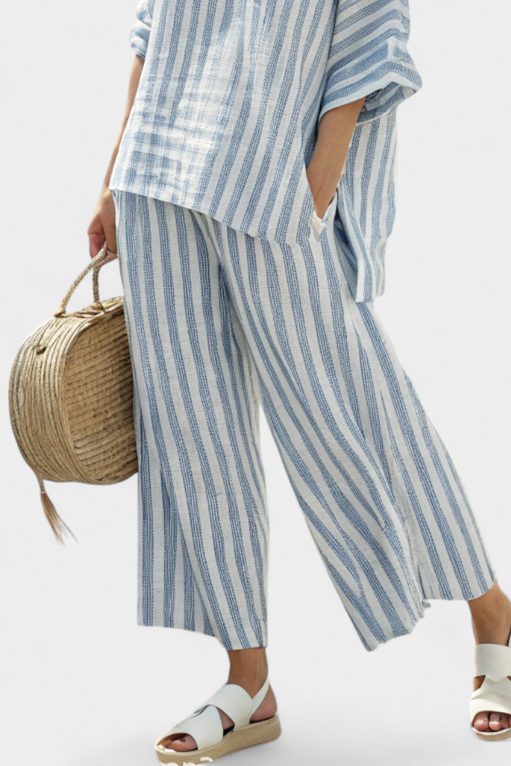 Comfortable women's blue stripe top & relaxed pants set, ideal for casual wear, summer, or vacation.