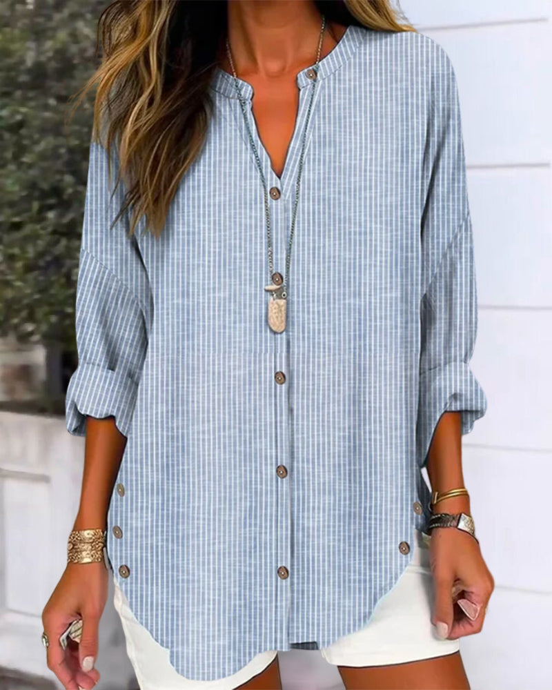 Women's blue striped V-neck top, effortless casual wear for everyday style, relaxed fit chic blouse.