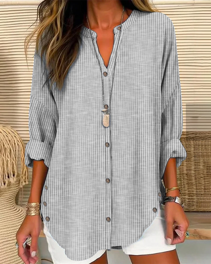 Effortless women's top featuring blue stripes and a V-neck, ideal for relaxed fit casual and everyday fashion.