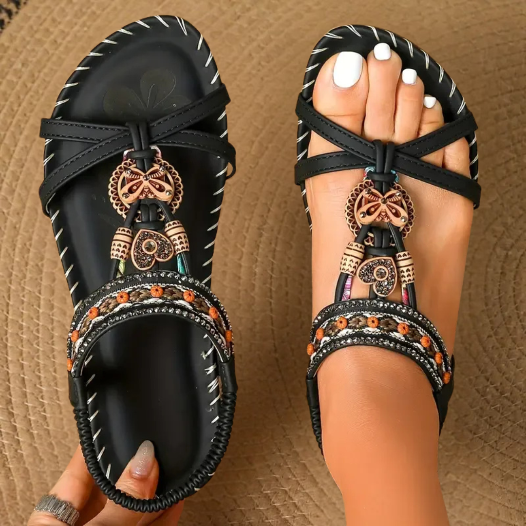 Embellished bohemian flat T-strap sandals for women, stylish summer footwear for a casual look.